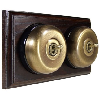 2 Gang 2 Way Antique Brass Smooth Dome With Black Pattress On Horizontal Dark Oak Base