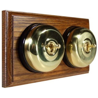 2 Gang 2 Way Polished Brass Smooth Dome with Black Pattress Horizontal Med Oak Base