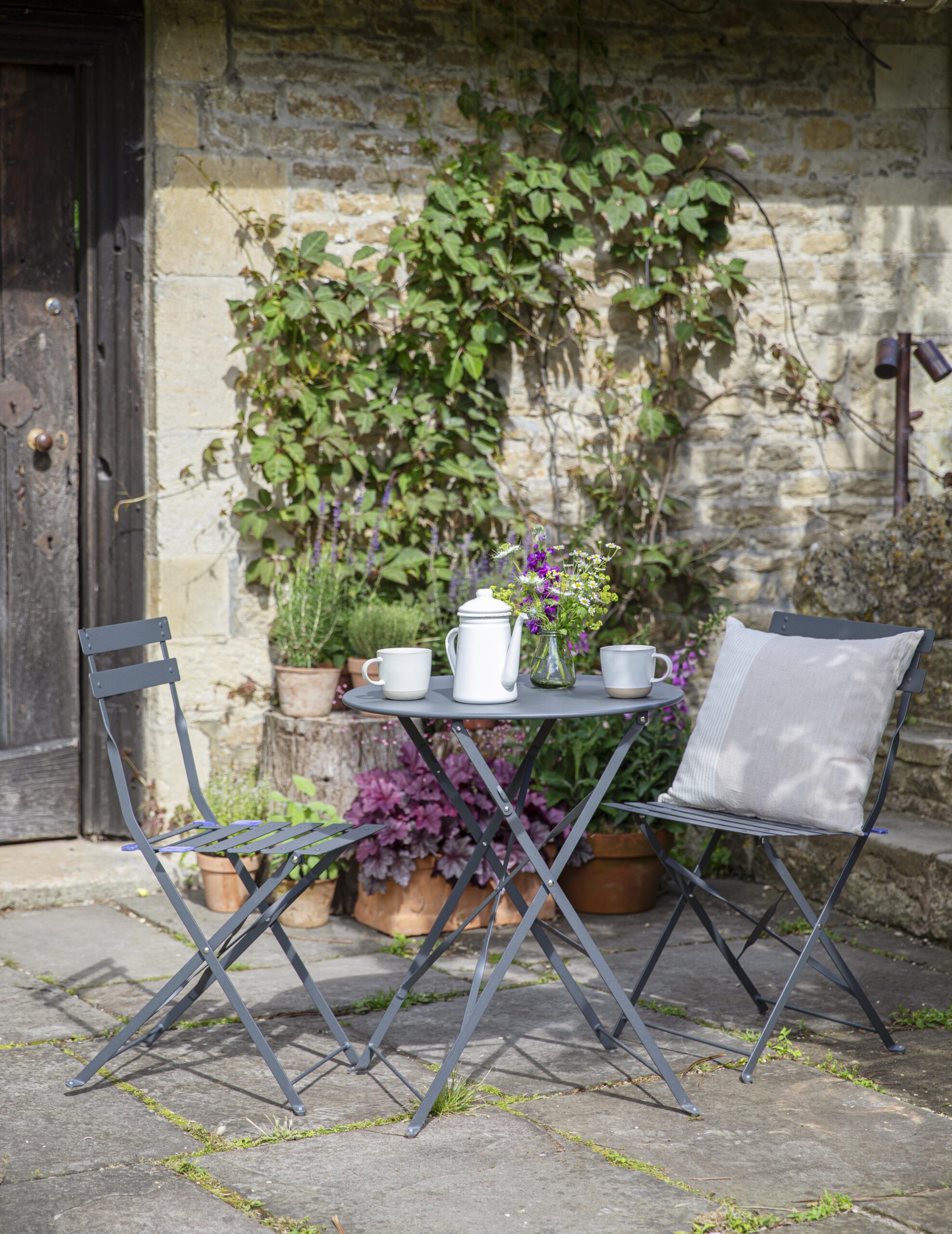 small round garden table and 2 chairs