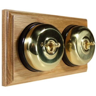 2 Gang 2 Way Polished Brass Smooth Dome with Black Pattress Horizontal Light Oak Base